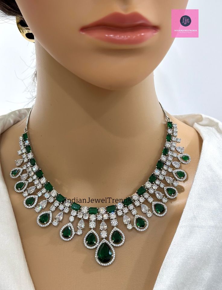 Emerald CZ diamond bridal necklace, American Diamond wedding necklace, Cz jewelry, Indian, Pakistani, and Punjabi wedding jewelry  Regular Size And Adjustable with rhodium finish Ships from California, USA Delivery in 2-5 business days in the USA. Other colors can be found here https://www.etsy.com/listing/1423096838/ruby-cz-diamond-bridal-necklace-american?ref=listings_manager_grid https://www.etsy.com/listing/1423097794/sapphire-cz-diamond-bridal-necklace?ref=listings_manager_grid Color, shades, and texture displayed may slightly vary from the actual product due to digital image limitations. We request you consider these minor variations. Please expect the possibility of some slight imperfections when buying handmade jewelry. Please let me know if you have any questions. Arrives in a gif Fine Jewelry Wedding Necklace With Sparkling Stones, Cubic Zirconia Bridal Necklace For Anniversary, Fine Jewelry Emerald Necklace With 17 Jewels For Wedding, Dazzling Hand Set Emerald Necklace For Anniversary, Dazzling Necklaces With Sparkling Stones For Reception, Dazzling Cubic Zirconia Necklace For Wedding, Dazzling Hand-set Emerald Necklace For Anniversary, Exquisite Cubic Zirconia Wedding Necklaces, Exquisite Cubic Zirconia Wedding Necklace