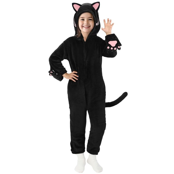 a child in a black cat costume waving