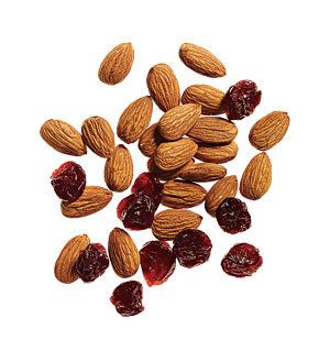 almonds and cranberries on a white background