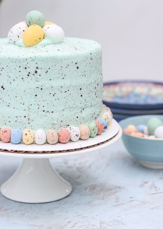 there is a blue cake with eggs on it