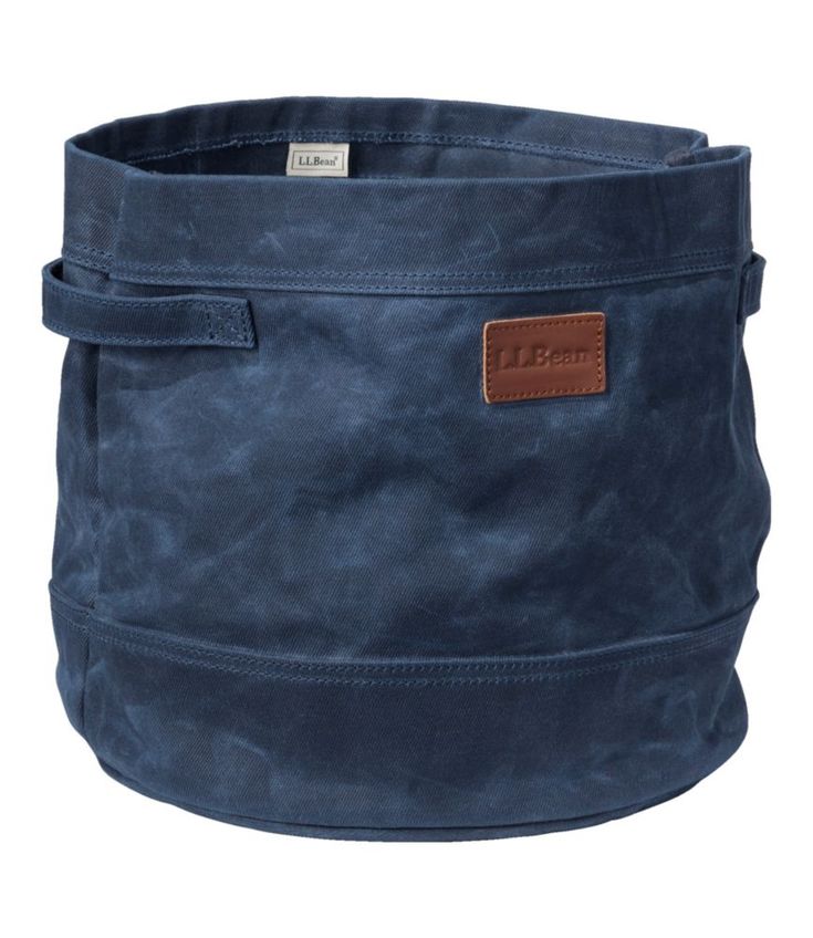 a large blue bag with leather handles