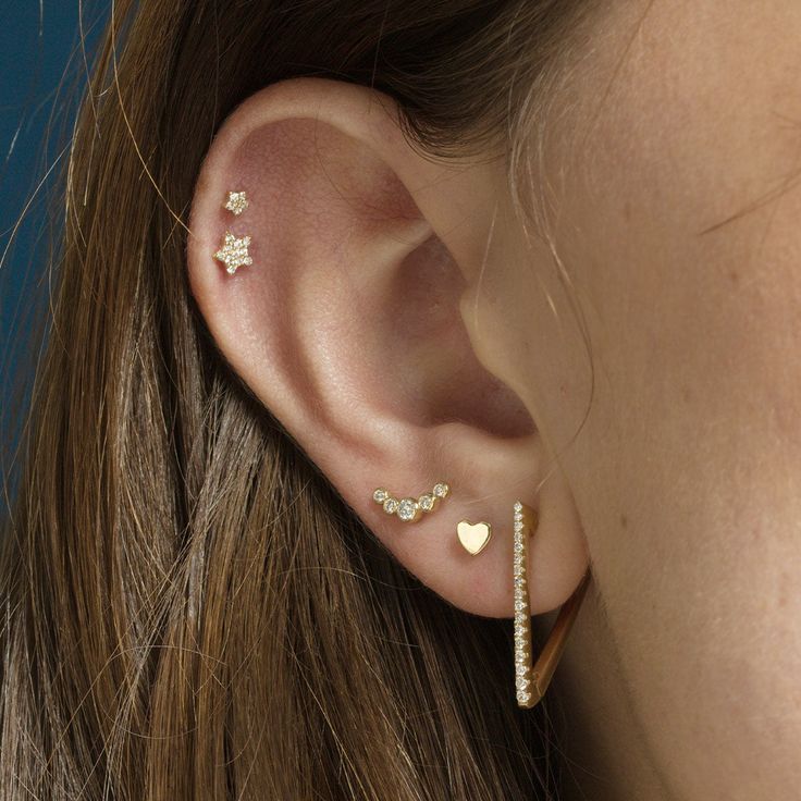 Shoot for the stars. This threaded flat back earring is packed with diamonds. Designed for extra comfort, this is the perfect dainty ear party addition to leave in and never take out. 18 Gauge Post Lengths: 5mm, 6.5mm or 8mm Solid 14K Gold and Diamonds Kimberley Certified Diamonds (Conflict Free) Single Earring Not sure what post length to get? Check out our Piercing Guide You may also like the Star and Moon Necklace Follow us on Instagram and Facebook Minimalist Anniversary Piercings With Diamond Accents, Dainty Diamond Piercings For Everyday, Dainty Everyday Diamond Piercings, Minimalist Sterling Silver Piercings With Diamond Accents, Minimalist Cartilage Earrings With Diamond Accents, Dainty Piercings With Diamond Accents As Gift, Dainty Piercings With Diamond Accents For Gifts, Tiny Diamond Earrings For Everyday, Everyday Tiny Diamond Earrings