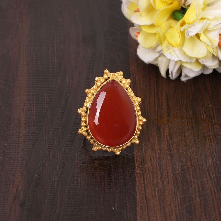 Natural Red Sardonyx Simple Band Rings, Statement Rings, Pear Cabochon, Unisex Ring, August Birthstone, Red Gemstone Rings, Gift For Special D E S C R I P T I O N  : Metal: Brass Plating: Gold Plated Gemstone: Natural Red Sardonyx Weight: 6.30 Gram Approx Stone Size: 20x15 MM Approx Gemstone Shape: Pear Cabochon Item Code: EMS-5237 ❣❣ Handmade Item ❣❣   **Made to Order** » G EM S T O N E D E T A I L « **Gemstone structure may vary from the image as two gemstones do not have the same structure** If you want to see the picture of gemstone, then feel free to contact us. » C U S T O M I Z E O R D E R « All gemstone jewelry is made with silver and brass. If you want to make any changes to this jewelry, then please send us a message. We will make as per your requirements. For more beautiful desi Red Teardrop Ruby Ring For Gift, Red Teardrop Ruby Rings, Gift Pear-shaped Red Ruby Ring, Pear-shaped Red Ruby Ring Gift, Gold Teardrop Ruby Ring Gift, Gold Teardrop Ruby Ring As Gift, Red Teardrop Gemstone Rings, Red Gemstone Ring, Simple Band