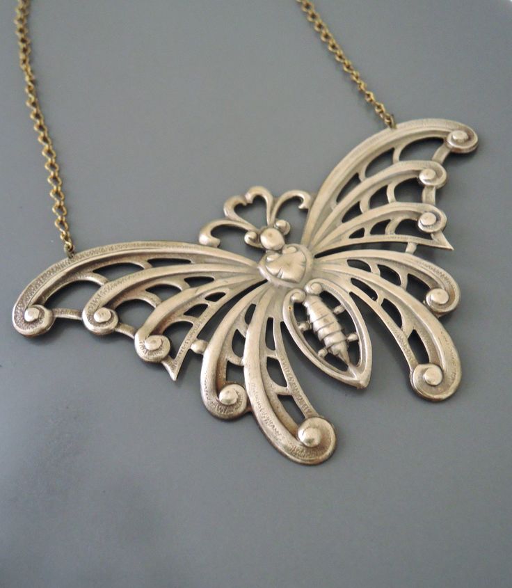 "Vintage Jewelry - Art Nouveau Necklace - Butterfly Necklace - Statement Necklace - Brass Necklace - Chloe's Vintage handmade jewelry This is such a stunning statement necklace! A large vintage brass butterfly hangs from a pretty brass ladder chain. So very bold and feminine. Chloe says, \"Wear it and feel fabulous!\" This pendant is 4\" wide and 2 1/4\" tall. You can choose the necklace length you would like at checkout. Thanks for visiting Chloe's" Metal Necklace For Gift, Decorative Metal Necklace As Gift, Decorative Metal Necklace For Gift, Unique Nickel Free Necklace For Wedding, Art Nouveau Necklaces, Bijoux Art Nouveau, Necklace Butterfly, Sweet Necklace, Vintage Jewelry Art