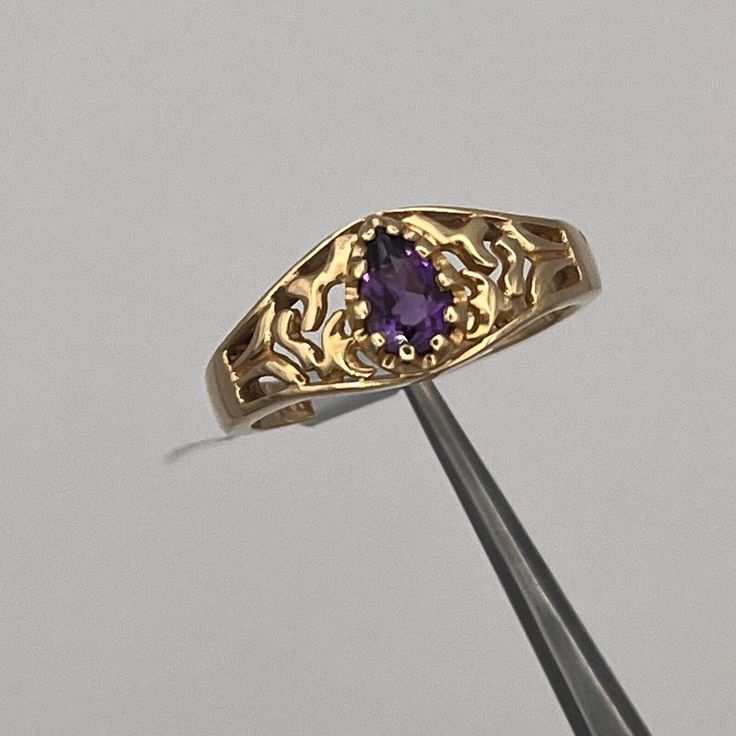 ITEM DESCRIPTION NEW 14K YELLOW GOLD FILIGREE PEAR AMETHYST RING, SIZE 6.25 Gender - Female Size - 6.25 Stone Type - 1 Pear Amethyst .37 cw Width - 2mm Shank Weight - 3.2Grams Markings - 14K Condition - New with Tag Additional Info Return Policy We stand behind every item we sell with a full 30-day, 100% money back guarantee! As a courtesy, please notify us of any return. Shipping Always fast & free unless otherwise stated. All items are shipped in our one-day handling time period (after payment is received & excluding weekends). Contact us for international shipping options. Always Ring, Amethyst Wedding Rings, Amethyst Engagement Ring, Amethyst Wedding, Vintage Gold Rings, Amethyst Ring Engagement, Purple Rings, Purple Gems, Princess Ring