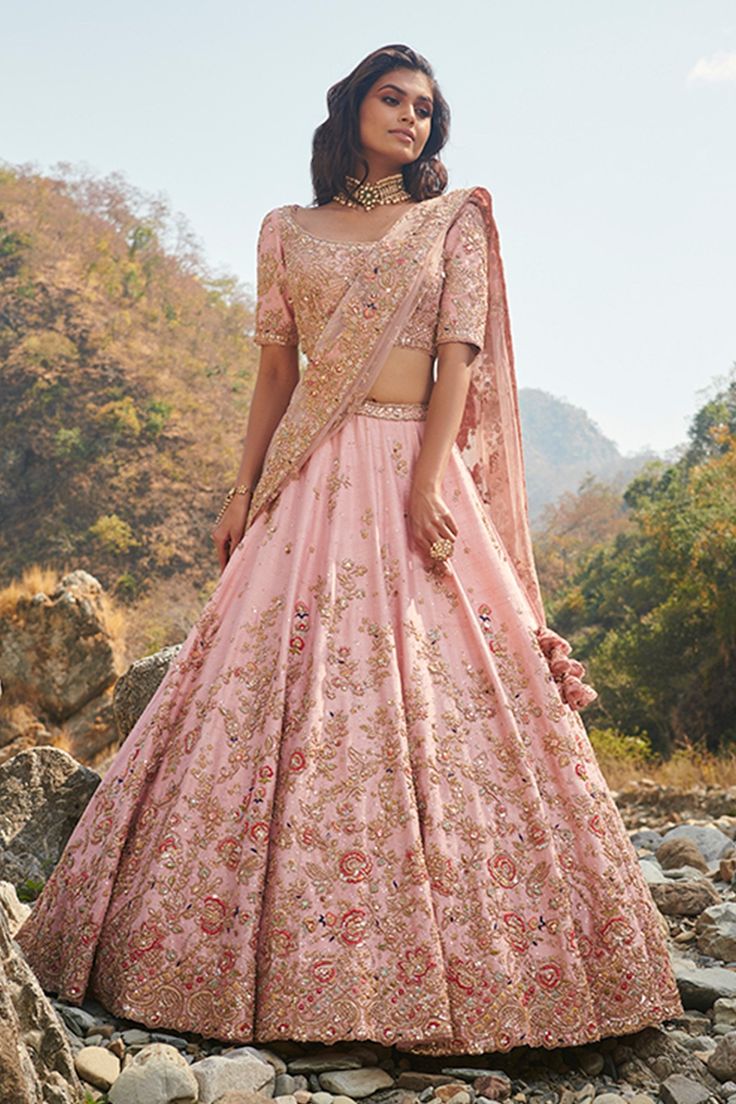 Pink raw silk lehenga with dori, resham and zardozi embroidery in floral motifs. Paired with embroidered blouse and two embroidered tassel dupattas. Component: 4 Embroidered Neckline: Scoop neck Sleeve Length: Elbow Fabric: Raw Silk Color: Pink Tassel dupattas Dori, resham and zardozi embroidery Floral motifs - Aza Fashions Dolly J, Raw Silk Embroidery, Raw Silk Lehenga, Indian Outfits Lehenga, Zardozi Embroidery, Blue Lehenga, Pink Lehenga, Silk Lehenga, Embroidered Neckline