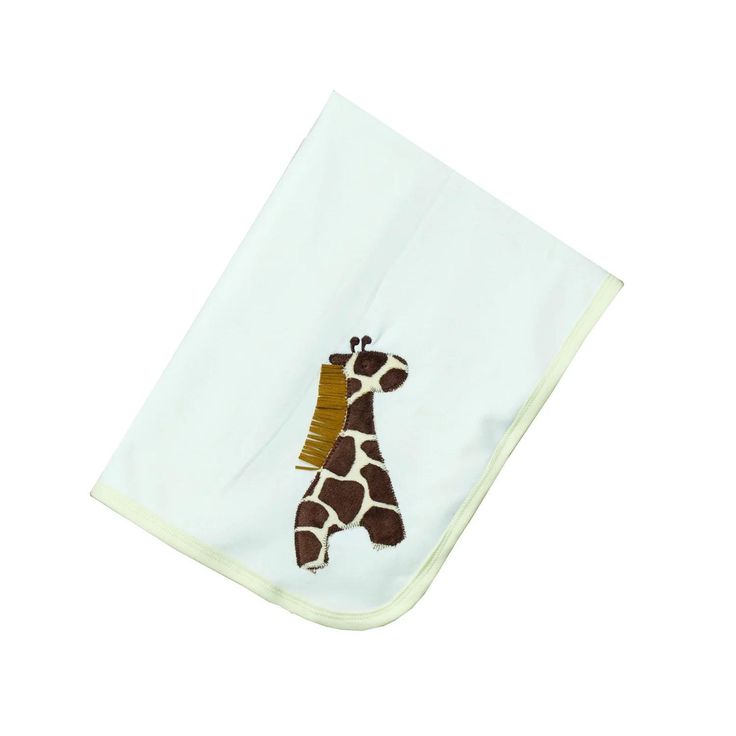 a white towel with a giraffe embroidered on it