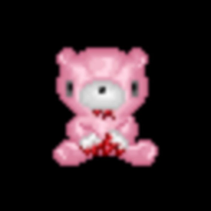 a pink teddy bear sitting on top of a black background