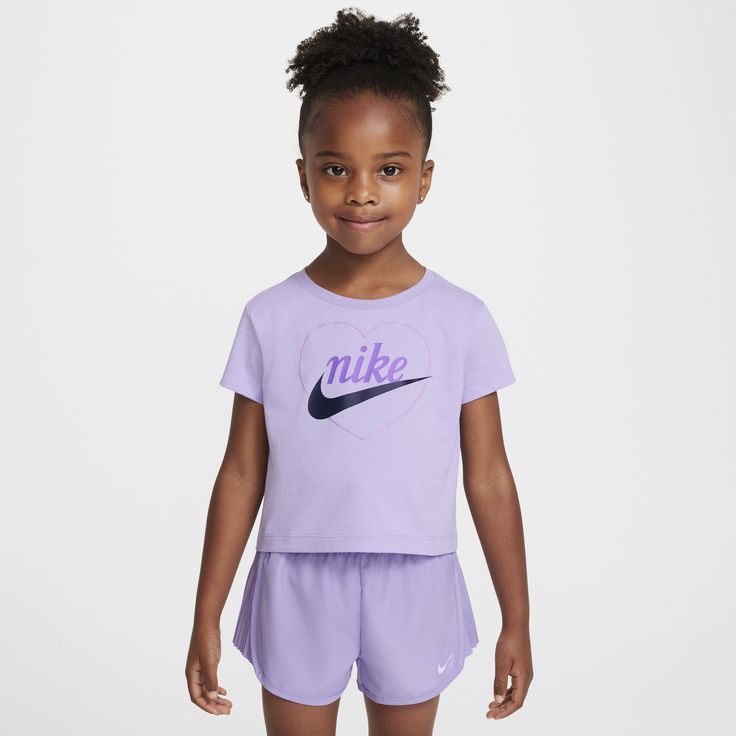 Your little one can make an impression at the playground, on the field or with classmates in this tee, which easily complements their Nikes. It's made of soft cotton/poly jersey knit fabric in a boxy cut that creates a modern, cropped look with a tagless crewneck for a comfy feel. Sporty Cotton T-shirt For Playwear, Nike Purple Crew Neck T-shirt, Spring Crew Neck T-shirt For Play, Spring Playwear Crew Neck T-shirt, Purple Sports T-shirt For Summer, Nike Sporty T-shirt For Play, Summer Sports Purple T-shirt, Playful Nike Tops For Sports, Sporty Crew Neck T-shirt For Playtime