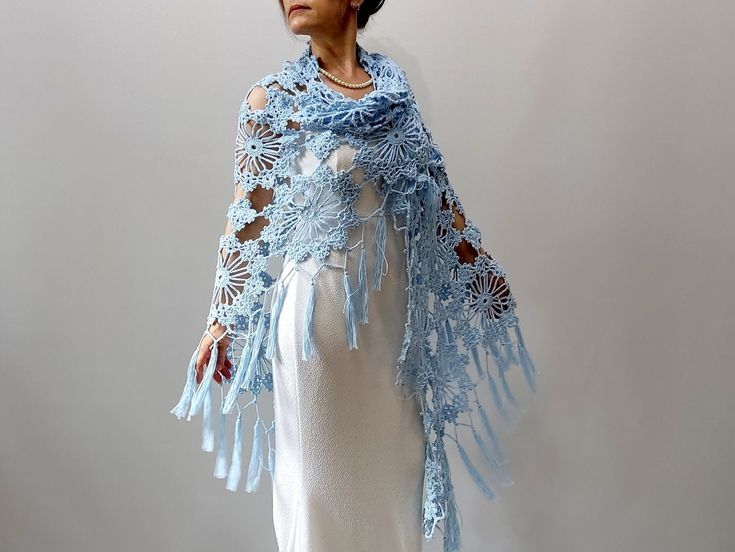 Light Blue Shawl MATERİAL: 100% pure cotton. COLOR: Blue as shown MEASUREMENTS: Length: 87'' ( 220cm) Width: 39'' (100cm) (without fringes) CARE INSTRUCTIONS: Hand washed or put in a delicate washing cycle of 40oC/104oF, or lower. İf you purchase 3 or more items please use ''BONUS'' as Coupon Code for 10% discount during the check out. More shawls and wraps in my shop: https://www.etsy.com/shop/Minnoshko?ref=l2-shopheader-name§ion_id=20621720 More handmade accessories and clothing in my shop: ht Bohemian Blue Shawl For The Beach, Blue Bohemian Shawl For Summer, Handmade Blue Shawl For The Beach, Blue Bohemian Shawl For Spring, Blue Handmade Beach Shawl, Bohemian Crochet Lace Shawl For Summer, Bohemian Crochet Lace Shawl For Spring, Handmade Shawl For Beach In Spring, Blue Bohemian Shawl Wrap