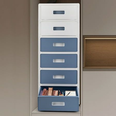 a white and blue filing cabinet with drawers