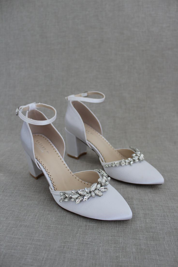 Classic and elegant satin almond toe block heels with added marquise rhinestones are the perfect shoes for weddings, parties or any special occasionDETAILS:HEEL HEIGHT: 2.75 inchesCOLORS AVAILABLE: Champagne, White, Ivory, Navy, Burgundy, and Light BlueUPPER: Synthetic upper and liningMATERIALS: Mandmade outsoleSTYLE NAME: SALLY Embellished Block Heel Wedding Shoes For Prom, Embellished Wedding Shoes For Prom With Block Heel, Satin Heels With Rhinestones For Prom, Glamorous Wedding Shoes With Block Heel, Satin Heels With Rhinestones For Wedding, Elegant Embellished Block Heel Wedding Shoes, Crystal Ankle Strap Heels For Wedding, Wedding Crystal Heels With Ankle Strap, Glamorous Satin Wedding Heels