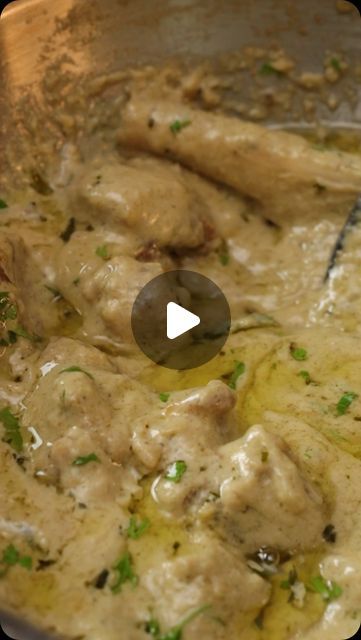 a pan filled with meat and gravy on top of a stove