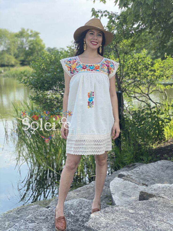 This Adorable Babydoll Dress is the perfect addition to your wardrobe. It's made out of fresh cotton or manta (as its called in Spanish) and it is hand embroidered with cotton string. The design is unique with lace details throughout and the colorful embroidery reflects the Rich Mexican culture! Note: Shoes and Jewelry modeled may be purchased here: Shoes: https://www.etsy.com/es/listing/828873953/zapato-artesanal-de-plataforma-zapato?ref=listings_manager_grid Filigrana Earrings: https://www.ets Festival Cotton Dress With Embroidered Hem, Cotton Festival Dress With Embroidered Hem, Multicolor Fitted Cotton Embroidered Dress, Fitted Cotton Embroidered Beach Dress, Spring Cotton Embroidered Dress With Machine Embroidery, Short Sleeve Cotton Dress With Geometric Embroidery, Cotton Embroidered Dress With Machine Embroidery For Spring, Cotton Dresses With Geometric Embroidery And Short Sleeves, Beach Cotton Dress With Multicolor Embroidery