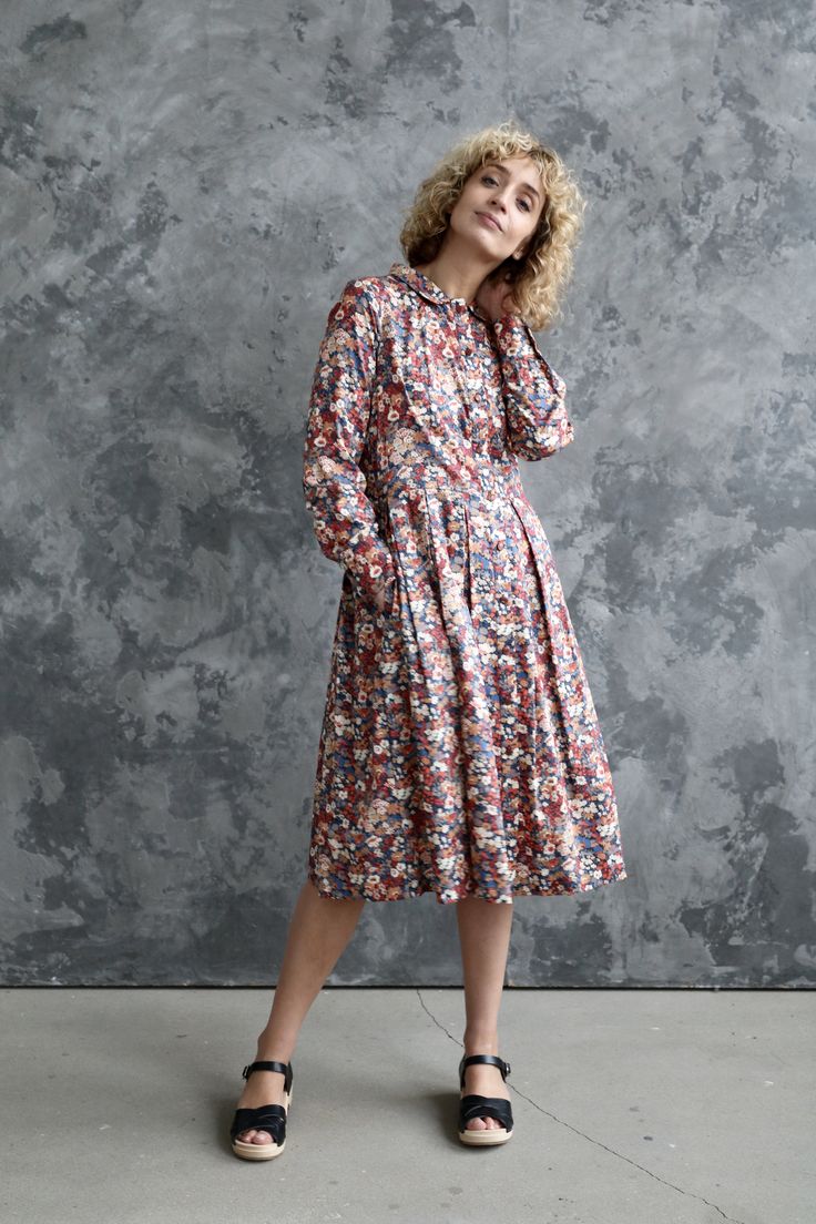 Modest Long Sleeve Dress For Spring, Casual Long Sleeve Cotton Dress For Fall, Cotton Floral Print Midi Dress For Daywear, Cotton Floral Midi Dress For Daywear, Cotton Midi Dress With Pockets For Fall, Cotton Smock Midi Dress, Cotton Smock Midi Dress For Daywear, Long Sleeve Cotton Midi Dress With Pockets, Spring Long Sleeve Prairie Dress For Daywear