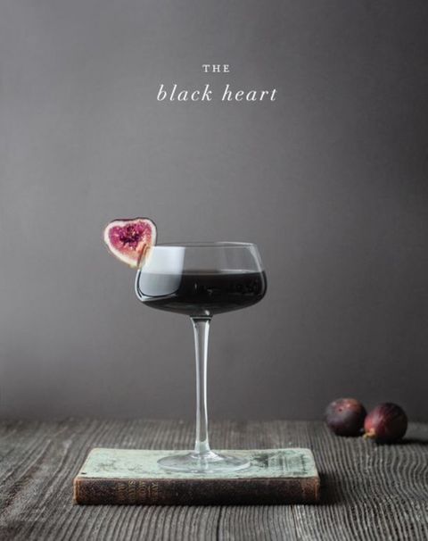 the black heart cocktail is garnished with figs