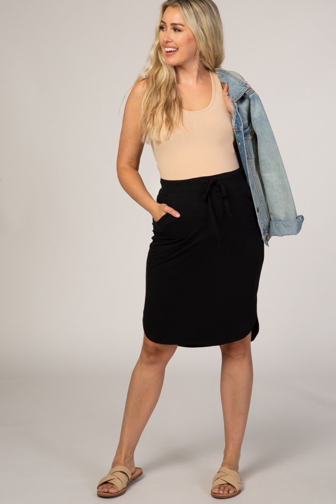 A basic skirt with side pockets and an elastic drawstring waist. The Black Maternity Skirt is perfectly bump-friendly! Casual Skirt With Elastic Waistband For Everyday, Casual Everyday Skirt With Elastic Waistband, Casual Mini Cargo Skirt With Elastic Waistband, Drawstring Skirt For Day Out, Day Out Skirt With Drawstring, Relaxed Drawstring Skirt, Casual Knee-length Everyday Skirt, Flowy Drawstring Skirt For Day Out, Casual Everyday Knee-length Skirt