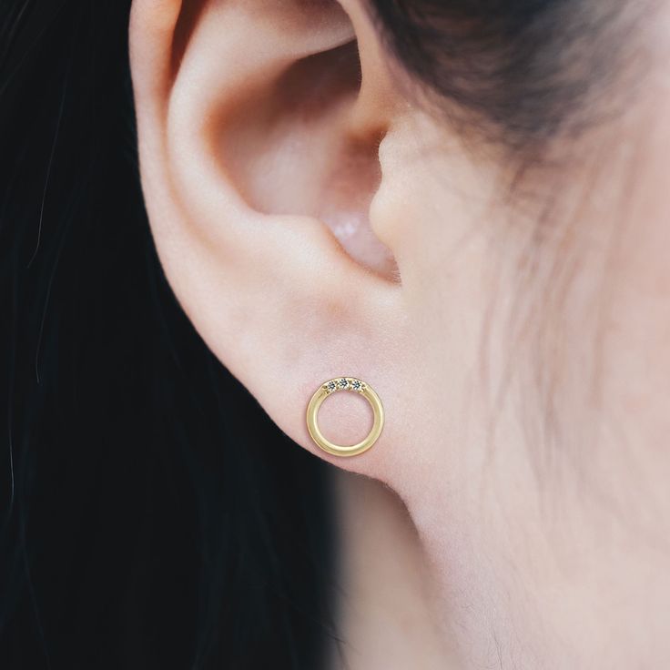 Available in both 925 Sterling Silver or 14K Gold over 925 Sterling Silver Nickel-free and lead-free Hypoallergenic and antimicrobial Boma 925 hallmark is located on the earring posts. Code : EV(G) 9036CZ Dimensions :approx. 3/8" width x 3/8" height * Earrings that speak volumes. We are all ears. Whether you're looking for a unique pair of everyday earrings or something extra special to layer with your favorite pieces, our circle mini cz studs are perfect to complete your look and complement you Hypoallergenic 14k Gold Round Earrings, Pierced Round Yellow Gold Diamond Earrings, Round Yellow Gold Diamond Pierced Earrings, Hypoallergenic Yellow Gold Sterling Silver Earrings, Gold Sterling Silver Earrings For Anniversary, Dainty Yellow Gold Circular Earrings, Gold Tarnish-resistant Round Diamond Earrings, Nickel-free Yellow Gold Jewelry For Anniversary, Classic Gold Diamond Earrings Hypoallergenic