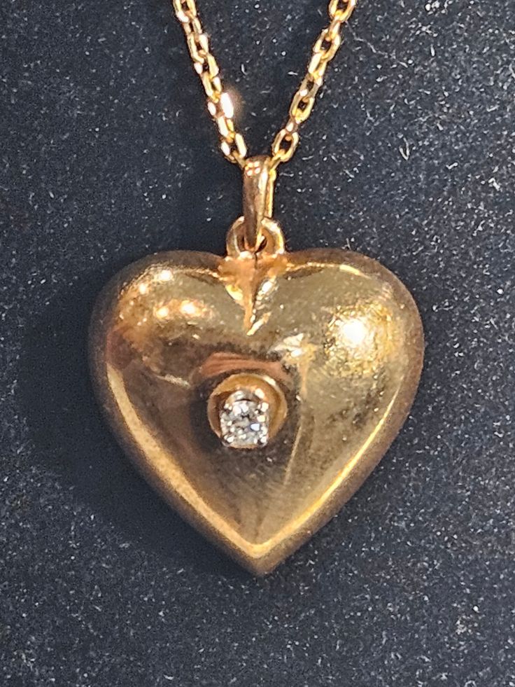 Heart  vintage 14K Gold chain and  heart pendant with  center diamond  Stone diamond 0.10 carats Chain signed 585 14K gold  Chain length 18 inches Total weight 8.7 gramms 14K  Shiny  amazing  One of a kind ! Victorian Heart Pendant Necklaces For Valentine's Day, Victorian Heart Pendant Necklace For Valentine's Day, Vintage Diamond Necklace In Yellow Gold, Antique Heart-shaped 14k Gold Necklace, Vintage Yellow Gold Necklace With Diamond Accents, Classic Gold Diamond Necklace With Heart Charm, Victorian Heart-shaped Necklace For Formal Occasions, Victorian Heart Necklace For Formal Occasions, Victorian Heart-shaped Formal Necklace