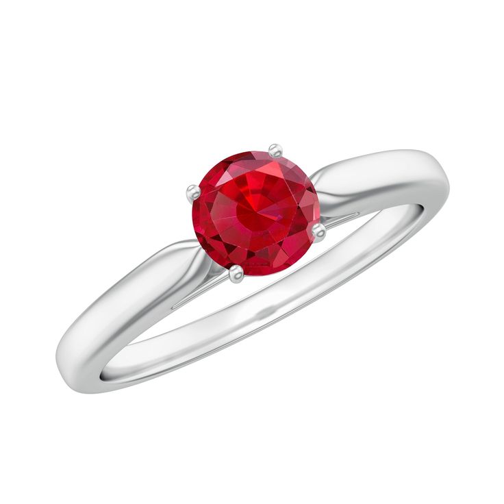 a white gold ring with a red stone