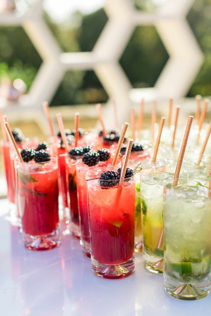 several glasses filled with different types of drinks