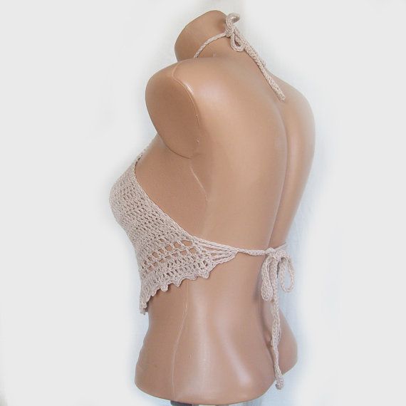 A charming crochet tank top , made with cotton/acrylic yarn (55%/45%). This beige crop top is perfect for Festivals, summer days, night out on the town and beachwear. It is lightweight , soft and comfortable . You can wear this high neck top with jeans, shorts or skirt . It has Bohemian Triangle Halter Top With Stretch, Bohemian Stretch Triangle Halter Top, Beige Triangle Halter Top For Summer, Summer Beige Triangle Halter Top, Summer Beige Crochet Halter Neck Top, Beige Halter Neck Crochet Top For Summer, Beige Summer Halter Top For Festivals, Beachwear Crochet Lace Halter Top, Beachwear Halter Top With Crochet Lace