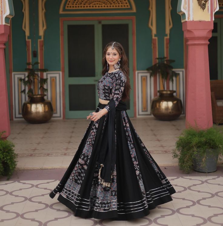 Traditional Black Printed Navratri Chaniya Choli for Women, Navratri Choli, Festive & Wedding Wear Lehenga, Navratri Garba lehenga Choli, Ship to USA, Navratri lehenga for women, Women Lehenga choli dress, women tradition lehenga. 👉🏻 Lehenga :- Lehenga :- (Full-Stitched) Fabric & Work :- 14 Kg Printed Rayon With Gota Patti Lace And Printed Kali Pattern. Length :- 42'' Waist :- 42''  Inner :- Cotton Flair  :-  5 Mtr Closure :- Chain Attached & With Dori Latkan Stitching Type :- Kali Pattern 👉🏻 Blouse:- Blouse :- (Full-stitched) Fabric & Work :- 14 Kg Printed Reyon With Petch and Kodi Lace. Size :- 40''Stitched (User can Alter upto 42''-44'') Neck :- Round Neck   Sleeves :- Full Sleeves 👉🏻 Dupatta:-  Fabric & Work:- 14 Kg Printed Rayon Petch With Kodi Lace. Length:- 2.3 Mtr 👉🏻 Colour Black Chaniya Choli, Kali Pattern, Garba Lehenga, Chaniya Choli For Navratri, Choli For Navratri, Choli Navratri, Lehenga Navratri, Women Lehenga Choli, Women Lehenga