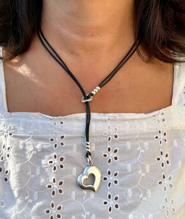 "This beautiful leather necklace is a great gift idea for a friend, a loved one or just for yourself. It is handmade to order by me using genuine leather cord - 2mm, matte silver plated heart 3cm x 2.5cm, silver plated beads and silver plated clasp.  📌CARE INSTRUCTIONS:  - Leather jewellery should **NOT** come in contact with water. Please take this into consideration when taking a shower, swimming etc. This is important to keep the leather cord in good condition for as long as possible. - Plea Leather Necklace Ideas, Leather Beaded Necklace, Leather Cord Jewelry, Bohemian Diy, Friendship Necklace, Leather Jewellery, Bolo Ties, Cord Jewelry, Necklace Love