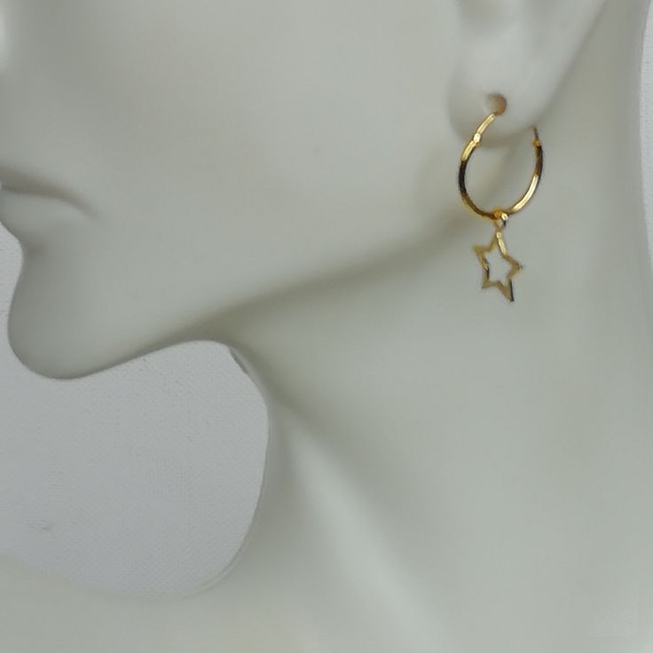 A PAIR of 12 mm sterling silver hoops. Comes with a delicate heart charm. Charm can be used with a neck chain or bracelet. Dimensions: Hoops: 12 x 1 mm Heart: 6 mm Drop length 19.5mm Weight: 0.85 gm These earrings are made of 925 hypoallergenic sterling silver dipped in gold. Price listed is for ONE PAIR Can be packaged in a gift box. I can include a personal message from you if needed You are welcome to contact me at... bhavnakwintra1956@gmail.com For more beautiful pieces from my shop, please Celestial Hoop Earrings With Star Charm, Celestial Star-shaped Huggie Earrings With Star Charm, Celestial Star-shaped Hoop Earrings, Celestial Small Hoop Jewelry With Star Charm, Celestial Tarnish-resistant Huggie Hoop Earrings, Minimalist Hoop Jewelry With Star Charm, Star-shaped Tarnish Resistant Hoop Earrings For Everyday, Celestial Small Hoop Earrings With Star Charm, Celestial Huggie Hoop Earrings For Everyday