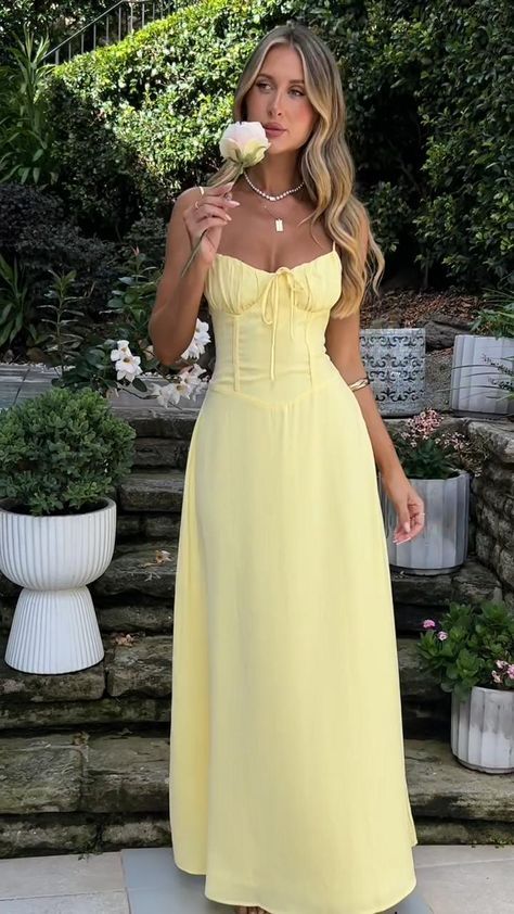 The Magdalena Maxi Dress is the perfect dress for any special event! It features a corset-style top with adjustable straps, a criss-cross tie-up back, and a cute bow detail in the centre. The double-lined material and invisible side zipper provide a comfortable and flattering fit. Complete the look with simple heels and gold jewellery! Strappy Summer Dress With Lace-up Back, Summer Square Neck Corset Dress For Prom, Summer Corset Dress With Spaghetti Straps For Brunch, Sleeveless Corset Dress With Fitted Bodice For Brunch, Spring Prom Corset Dress With Square Neck, Spring Suspender Dress With Fitted Bodice And Sweetheart Neckline, Summer Suspender Dress With Sweetheart Neckline And Fitted Bodice, Sweetheart Neckline Strappy Dress For Brunch, Fitted Strapless Dress With Tie Straps