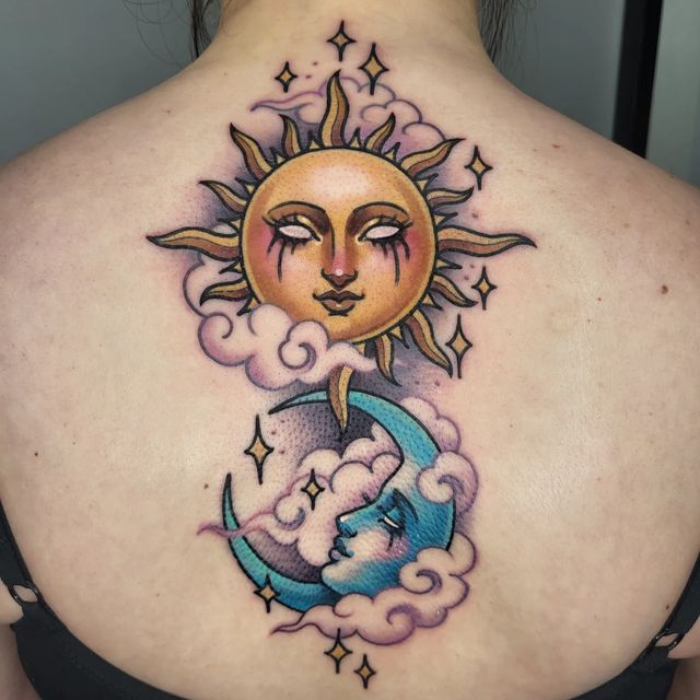 a woman with a sun and moon tattoo on her back