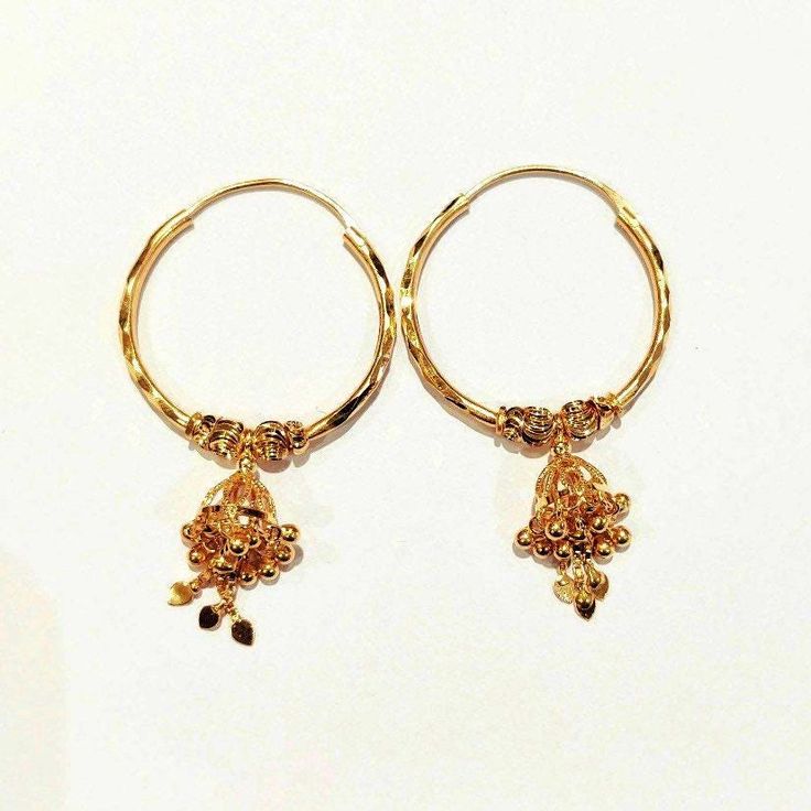 22k Solid Gold Handmade and Handcraftet Dangling Bell Hoops, Dangling Bell decorated with Mutiple Tiny Balls and Chain. Rajasthani Gold Jewelry, Indian Gold Dangling Hoops, Big Gold Hoops * Metal: 22k Solid Gold ( Hallmarked 916 & 22k) Not gold plated * Pure and Genuine 22k Gold ( Hallmarked 22k & 916) * Weight: 6 Gram ( approx) * Diameter of Hoop : 28mm * Total Length: 49mm One of a kind amazing Gold Hoops with Rajasthan Art Bell on it decorated with balls and chain. We welcome custom orders as Rajasthan Art, Gold Schmuck, Jewelry Indian, Gold Jewelry Indian, Gold Gift, Ear Rings, Keep Jewelry, Gold Hoops, Jewelry Earrings Hoops