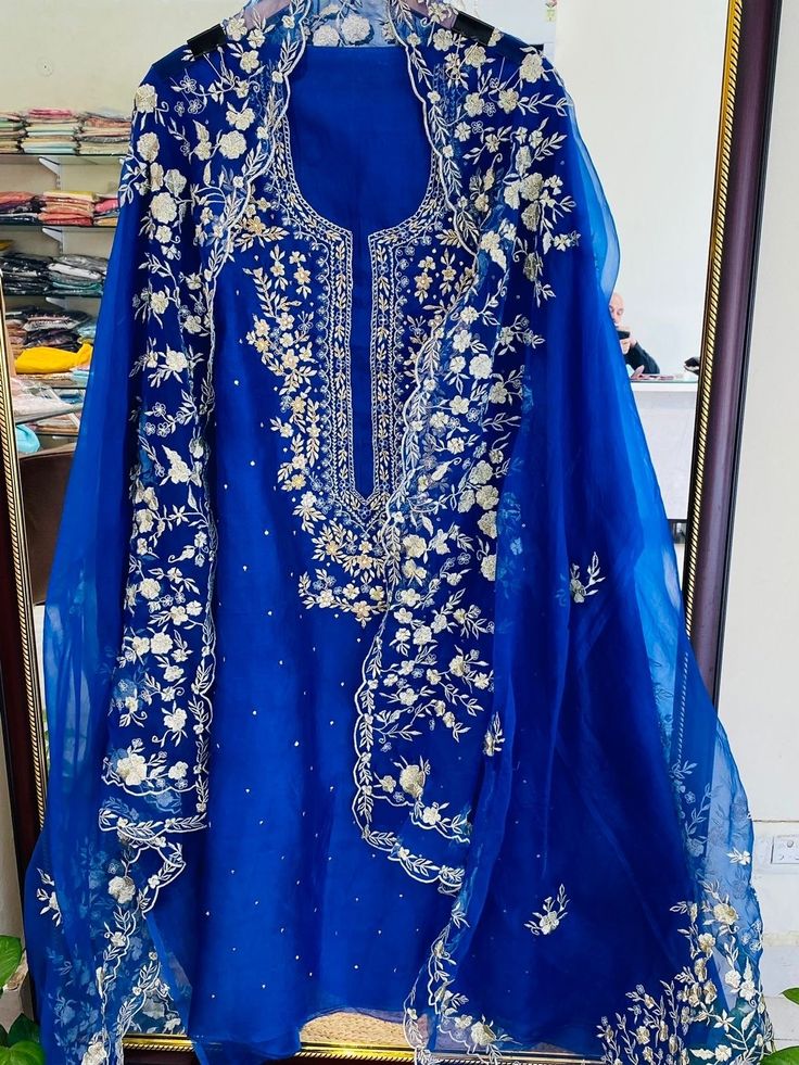 Item Overview ATHARVA Hand Embroidery Pure Organza Silk Salwar Kamiz & Dupatta /Electric Blue/Heirloom Worthy/Custom Stitch Unstitch/Wedding/ Dno. OG99017 Fabric:  * Shirt: Pure Organza Silk - Hand Embroidery/ 2.5 Mts Beautiful Zari Dabka Sequins Work * Dupatta: Pure Organza Silk - Hand Embroidery/ 2.5 Mts Beautiful Zari Dabka Sequins Work/Elegant/Tassels/ * Bottom: Crepe Silk  2.5 Mts. Excusive Hand Embroidered Party Wear Punjabi Suit. Customization: * Fabrics Customization: Designs Can be made in different Fabrics. *Color Customization: Designs Can be made in different Colors *Stitching Customization: 1. Salwar Kameez  2. Patiala Salwar Kameez  3. Churridar  4. Tunic Pants  5. Anarkali (Extra Charge) 6. Maxie (Extra Charge) 7. Plazzo Pants 8. Embroidered Pants or Salwars 9. Lehnga (Extra Patiala Salwar Kameez, Salwar Kamiz, Patiala Salwar, Embroidered Pants, Punjabi Suit, Work Suits, Punjabi Suits, Different Fabrics, Salwar Kameez