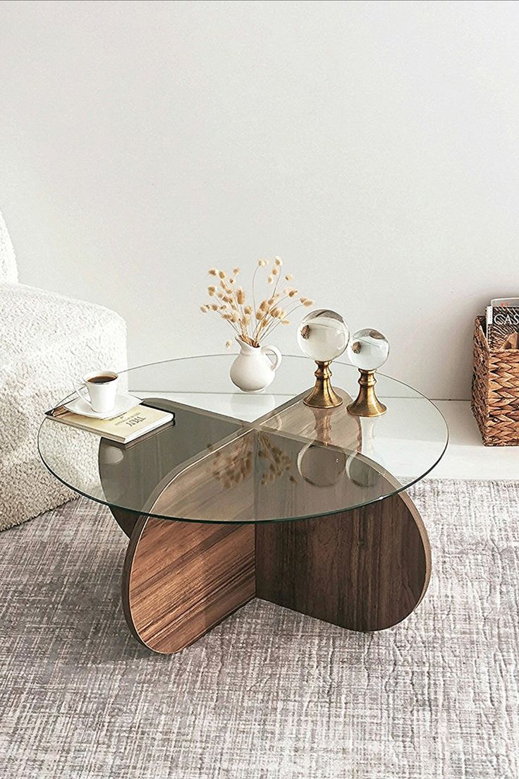 a glass table sitting on top of a carpeted floor