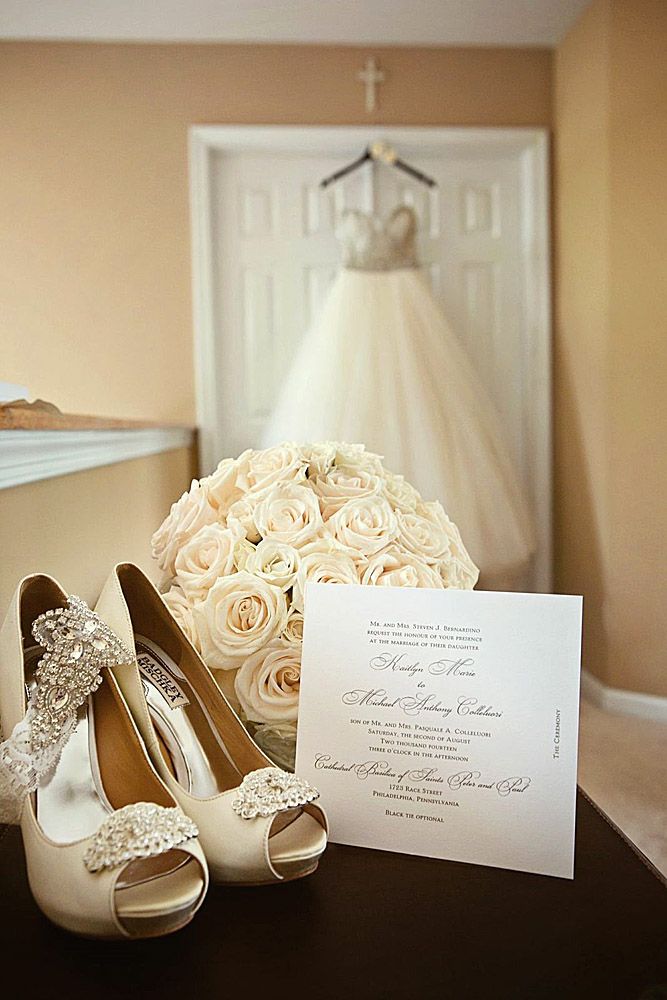 the wedding dress and shoes are on display in front of a card that reads, new jersey venue