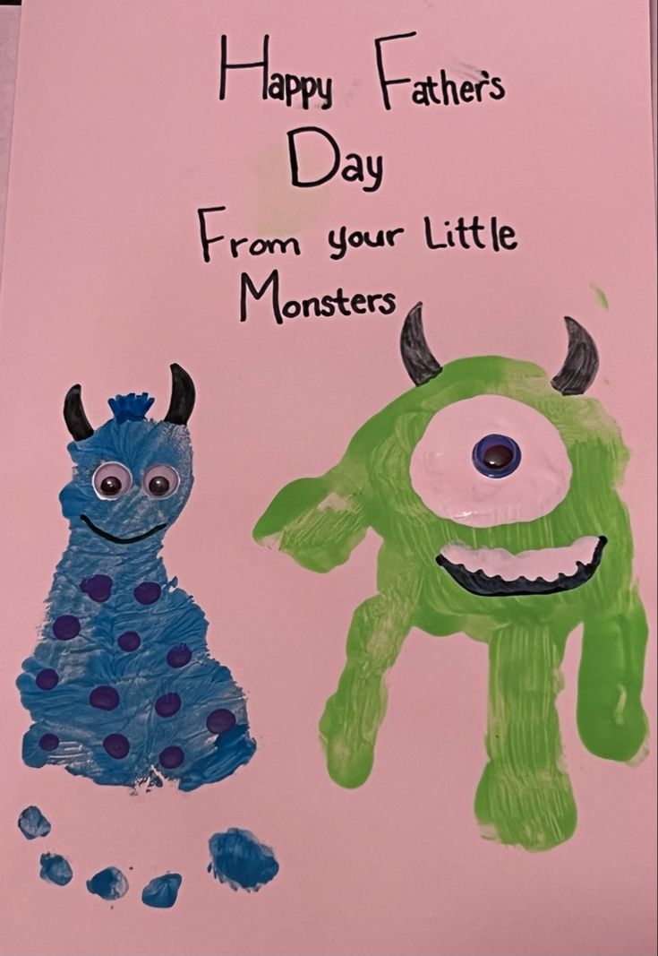 a child's handprinted card with an image of a monster and a monster