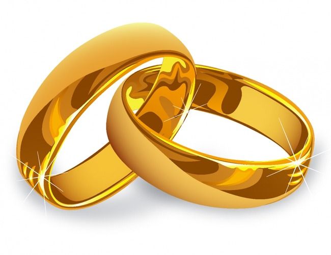 two gold wedding rings with sparkles on white background stock photo - 1307982