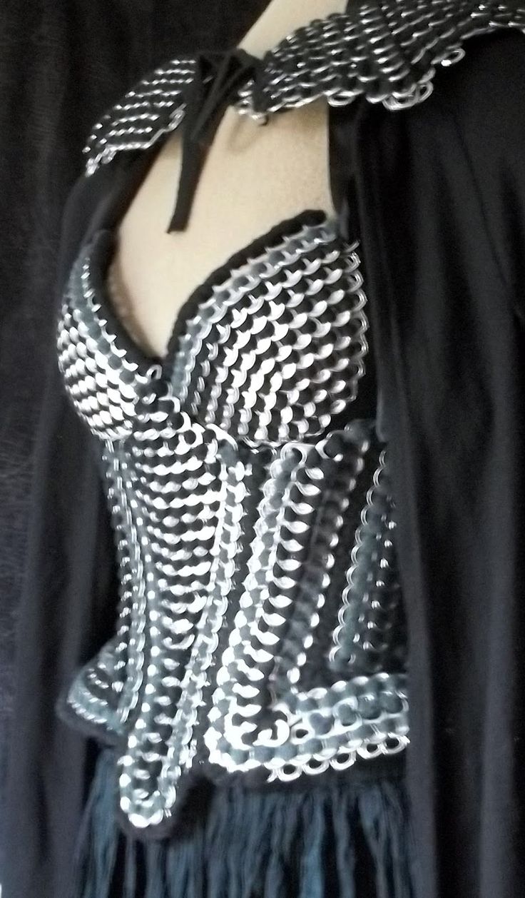 a woman's corset with black and white designs on it