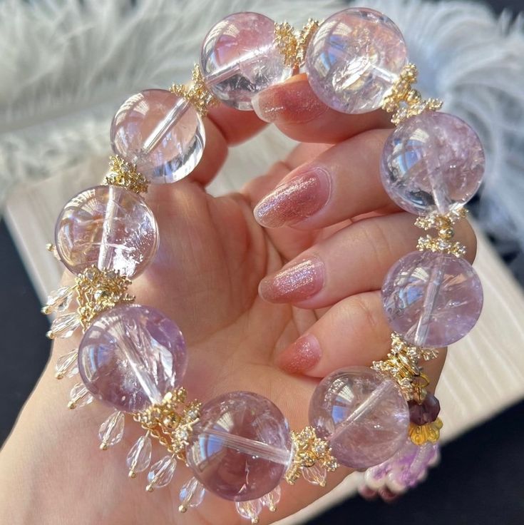 Material:Amethyst Quartz beads The accessories are alluvial gold. 14k gold-plated and inlaid with zircons. hand circumference around 16mm size :  18mm quantity: one strand  6mm approx 29 pcs one strands 7mm approx25 pcs one strands 8mm approx 22 pcs one strands 9mm approx 21pcs one strands 10mm approx 19 pcs one strands 11mm approx 18pcs one strands 12mm approx 16 pcs one strands 13mm approx 16 pcs one strands 14mm approx 15 pcs one strands 15mm approx 14pcs one strands 16mm approx 14 pcs one st Luxury Purple Jewelry With Round Beads, Spiritual Amethyst Gold Bracelets, Luxury Gold Beaded Gemstone Bracelets, Crystal Bracelet In Yellow Gold As Gift, Luxury Gold Beaded Bracelets With Gemstones, Luxury Gold Beaded Bracelet With Gemstones, Gift Yellow Gold Crystal Bracelet, Yellow Gold Round Crystal Bracelet Gift, Gold Beaded Amethyst Bracelets