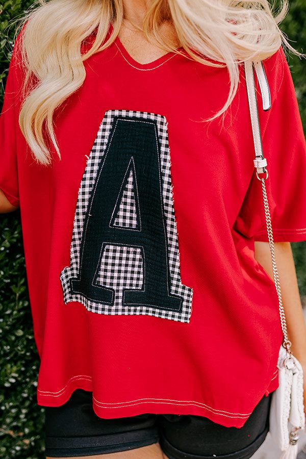 - Get ready to cheer your team on in style with this adorable top! It features a super cute black and white gingham 'A' patch on the front, adding a playful touch. Whether you are in the stands or having a blast at a watch party, this top is sure to make you stand out and feel fantastic. Go team! - Unlined material with white accent stitching - A black 'A' patch sewn on the front with black and white gingham accent material - A v-cut neckline - Short sleeves - A relaxed silhouette that ends in a Wedding Games For Guests, Ribbon Ideas, Go Team, Black And White Gingham, Cute Black And White, Summer Soiree, Field Day, Watch Party, Crop Top Sweater