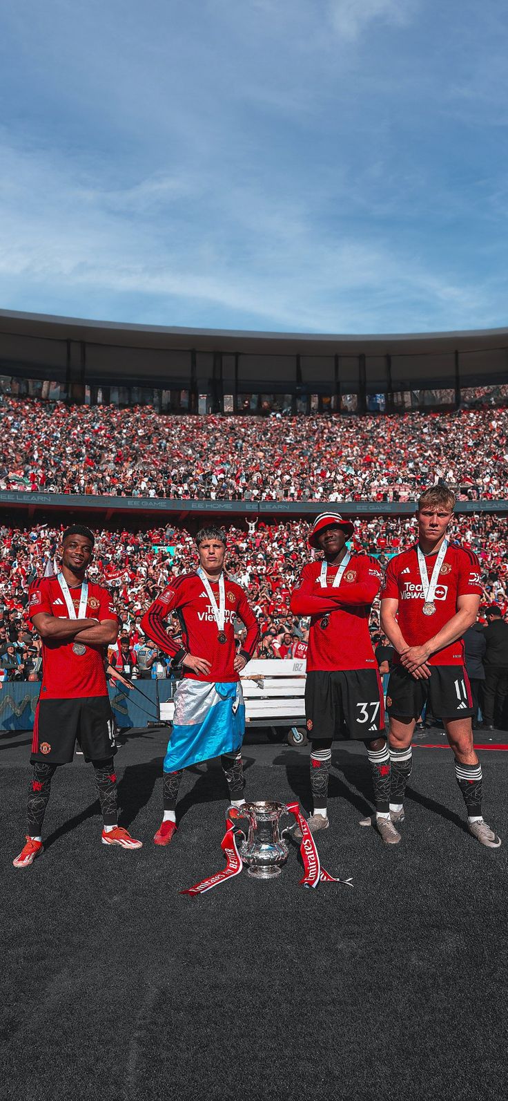 the soccer team is posing with their trophies