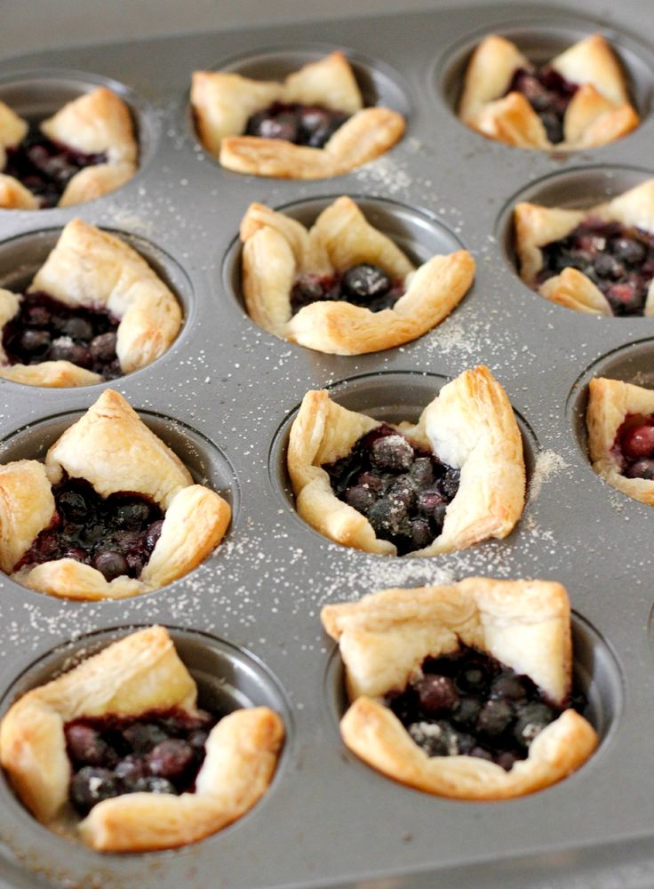 mini blueberry pies in a muffin tin