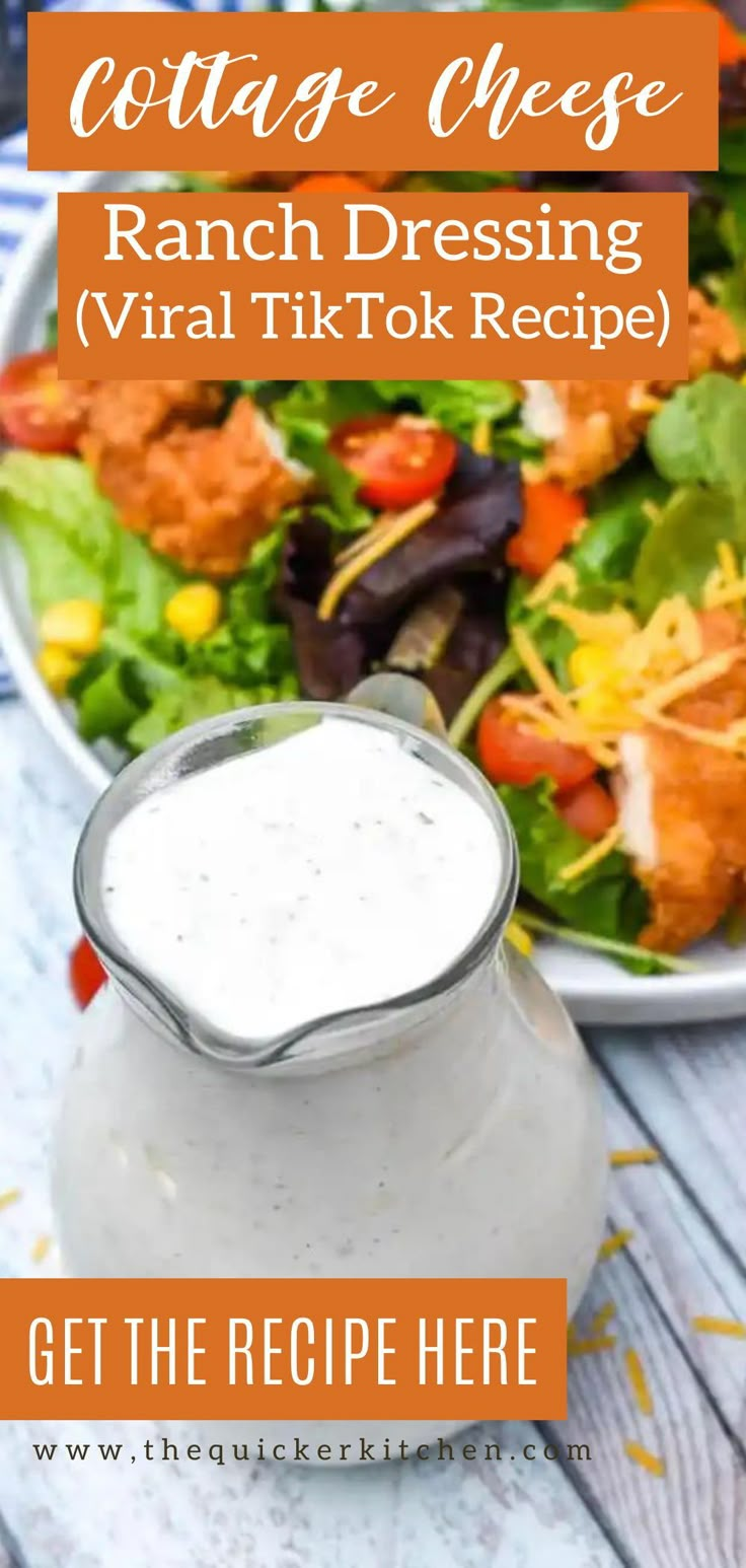 a salad with ranch dressing in a pitcher next to it