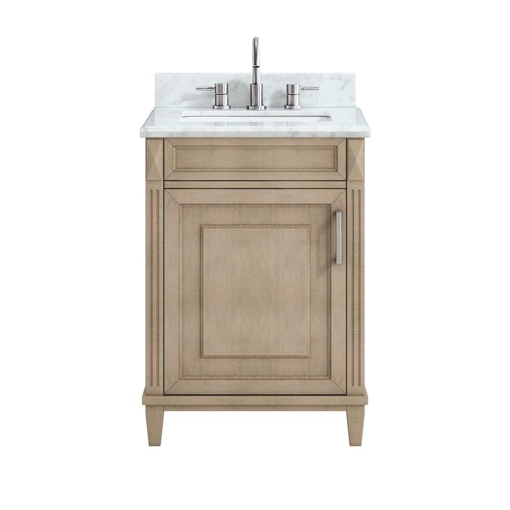 a white sink sitting under a wooden cabinet