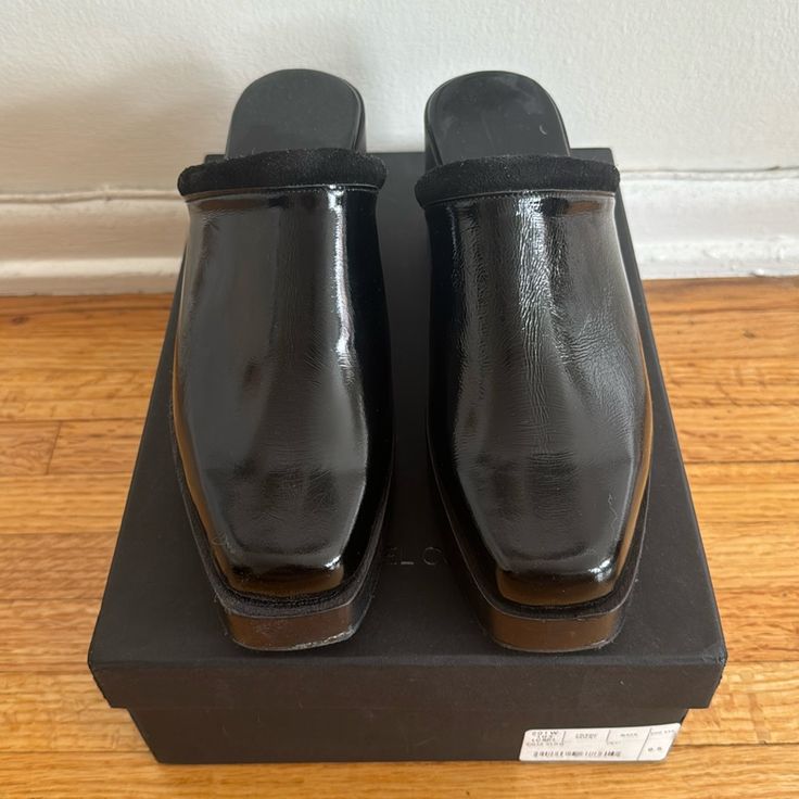 Rachel Comey Salta Clog Black Patent Leather Fits More Like An 8.5 *Very Small Scuff (Pictured) Can Barely See To Naked Eye Modern Black Clogs With Rubber Heel Cap, Black Leather Mules With Contrasting Heel, Black Square Toe Mules With Contrasting Heel, Leather Mules With Rubber Heel Cap For Formal Wear, Formal Leather Mules With Rubber Heel Cap, Closed Toe Leather Mules With Rubber Heel Cap, Leather Clogs With Wooden Heel And Square Toe, Leather Closed Toe Mules With Rubber Heel Cap, Black Leather Clogs With Rubber Sole