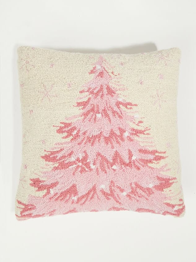 a pink christmas tree pillow on a white background