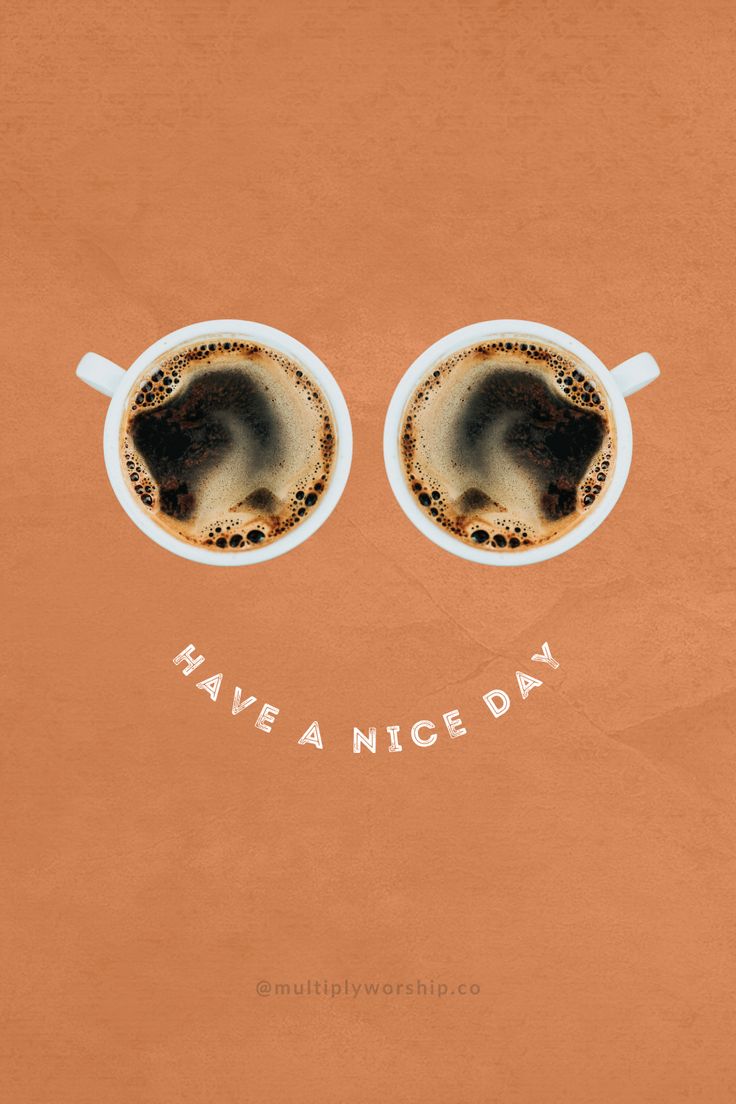 two cups of coffee with the words have a nice day written on them in front of their eyes