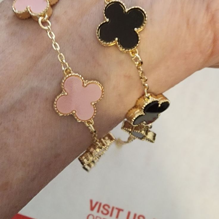 2 Clover Bracelets. Black/Gold And Pink/Gold. Non Tarnishing Stainless Steel Hypoallergenic 18kt Gold Plated