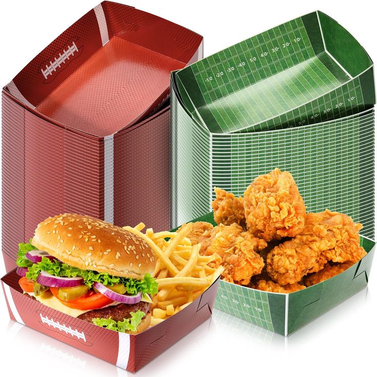 a chicken sandwich and french fries are in two boxes, one is red the other is green