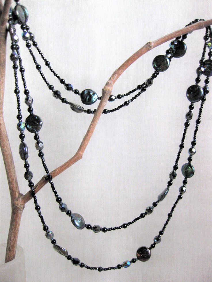 "black" coin pearls have great iridescense, accent with spinel & Swarovski crystals double strand, could double up for four strand adjustable length approx 39-3/4 to 43-1/2" sterling silver chain & lobster clasp matching earrings listed at additional cost Elegant Handmade Iridescent Crystal Necklace, Adjustable Multi-strand Pearl Necklace For Party, Adjustable Multi-strand Evening Jewelry, Adjustable Multi-strand Jewelry For Evening, Iridescent Adjustable Necklace With Round Beads, Iridescent Adjustable Round Bead Necklaces, Elegant Hematite Round Bead Necklaces, Elegant Hematite Round Bead Necklace, Adjustable Iridescent Round Necklaces